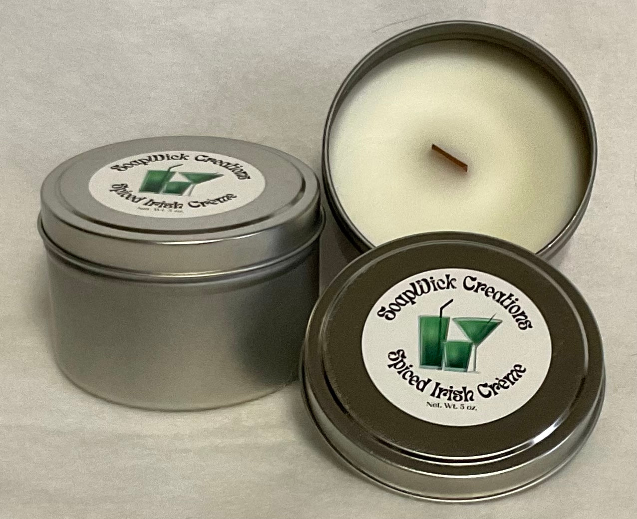 Photograph of silver metal tin containing white Spiced Irish Cream scented candle