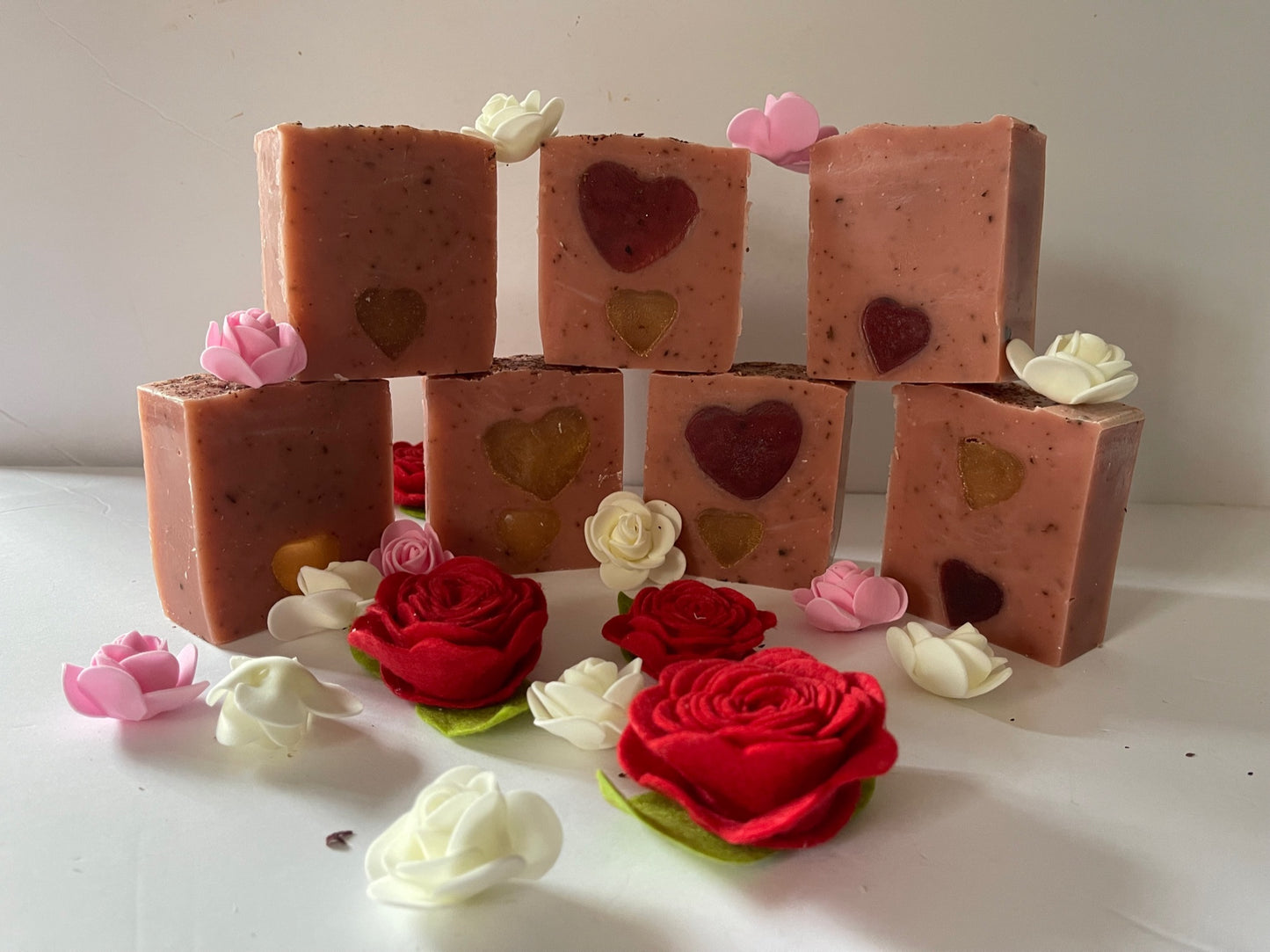 Photograph of rose scented soap with red and or gold heart embeds
