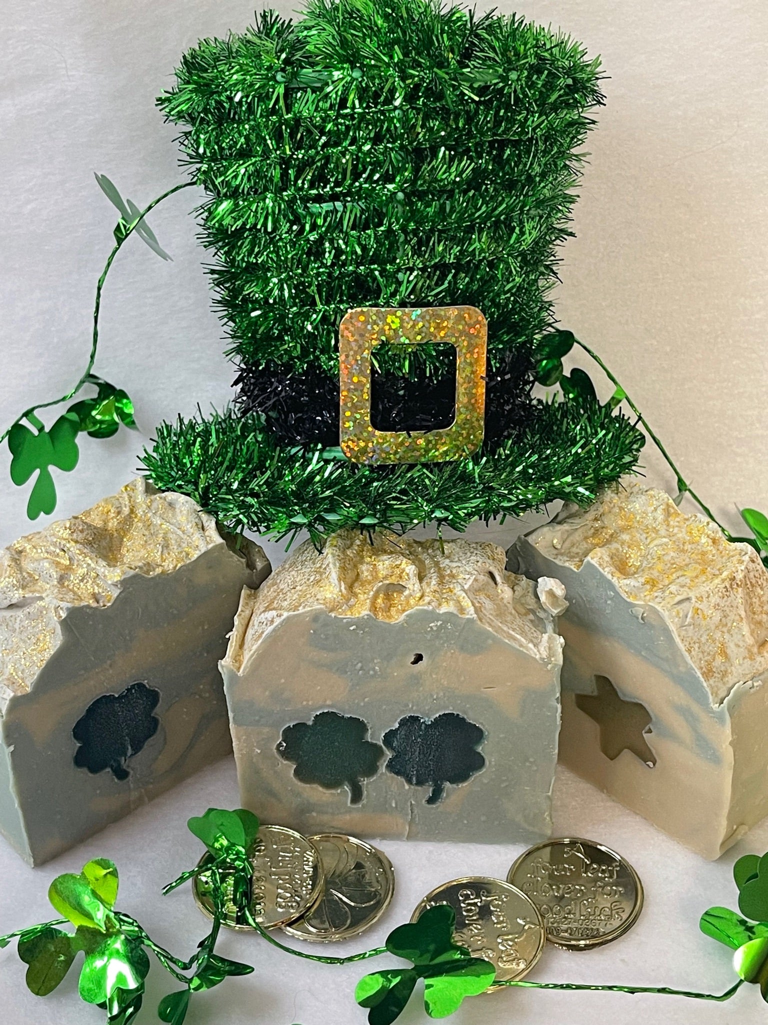 Photo of luck of the Irish soap with green clover and/or gold star embed with a green Irish, top hat