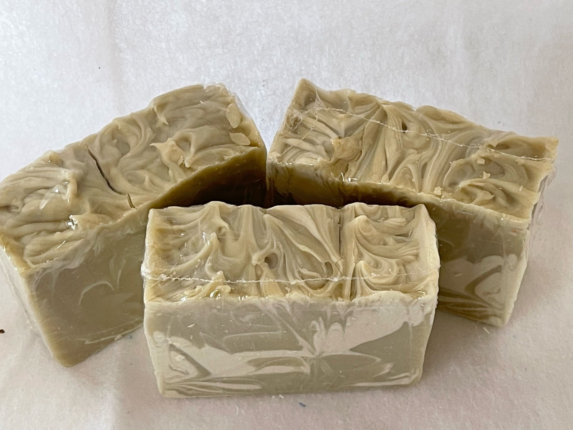 Moss green and white bars of forest mist soap