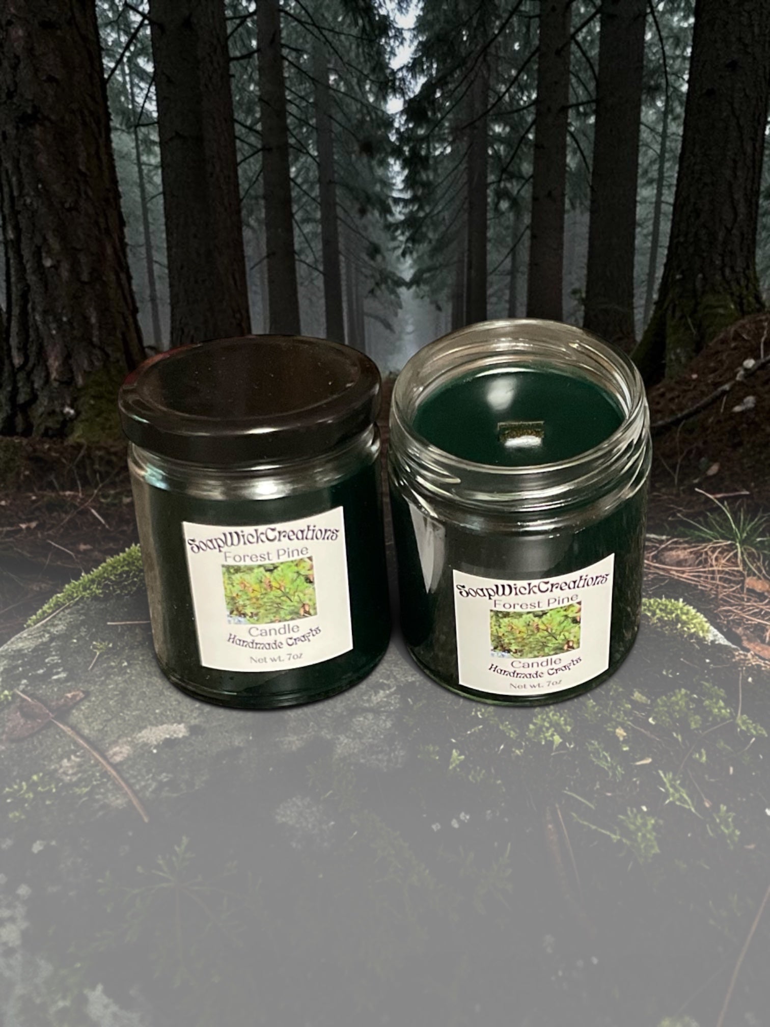 Two dark green forest pine scented candles, sitting on a mossy stone in the middle of a pine forest.