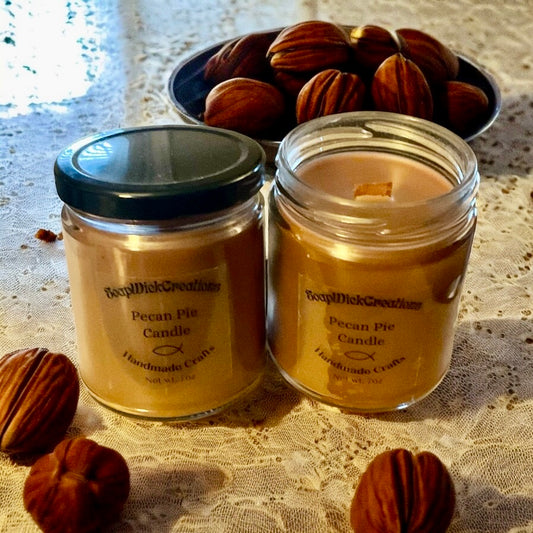 Pecan_Pie_scented_brown_candles_on_a_white_lace_tablecloth_with_pecans_in_the_foreground_and_in_a_bowl_in_the_background.