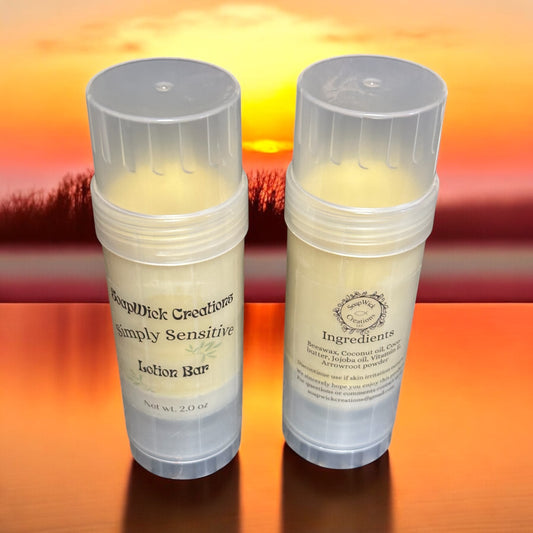 Who simply sensitive lotion bars in clear tube, sitting on a table with the sunset in the background.