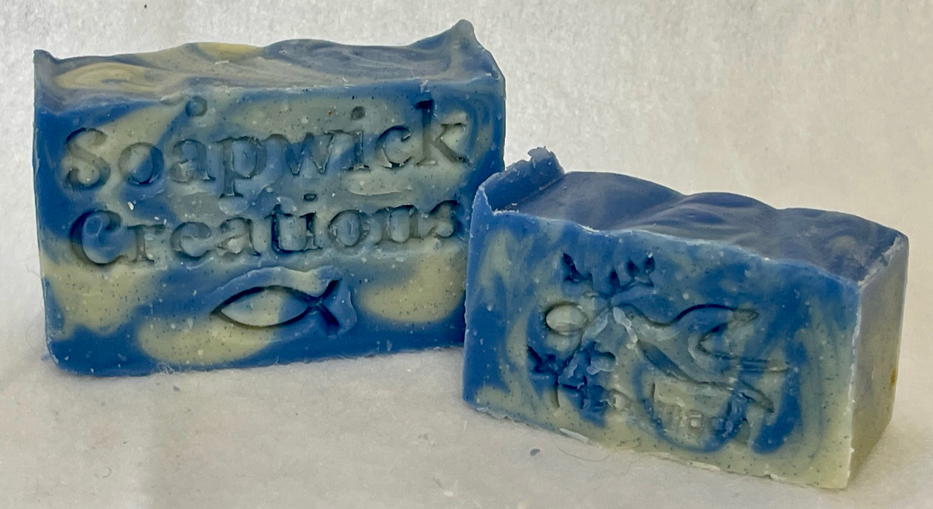 Picture of 2 blue and moss colored linen scented soap bars