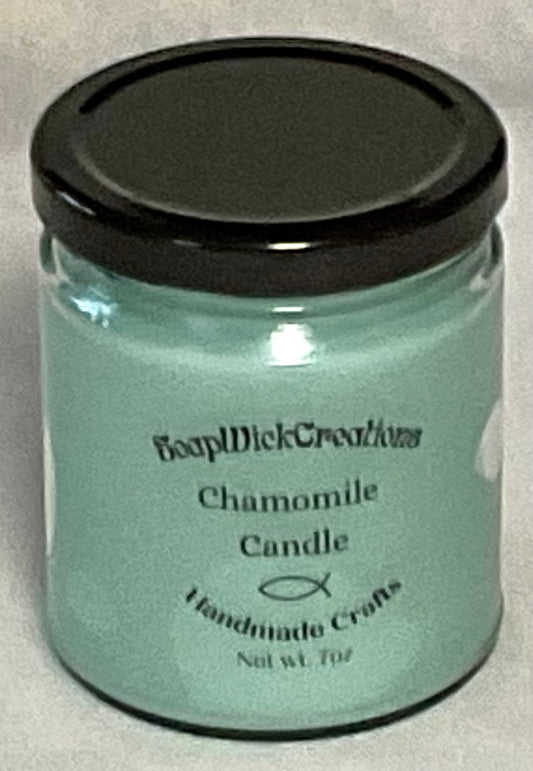 Photograph of light, mint colored candle with chamomile scent