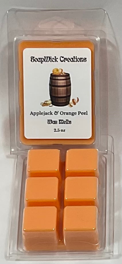 Photograph of orange colored wax melts with applejack and orange peels scent