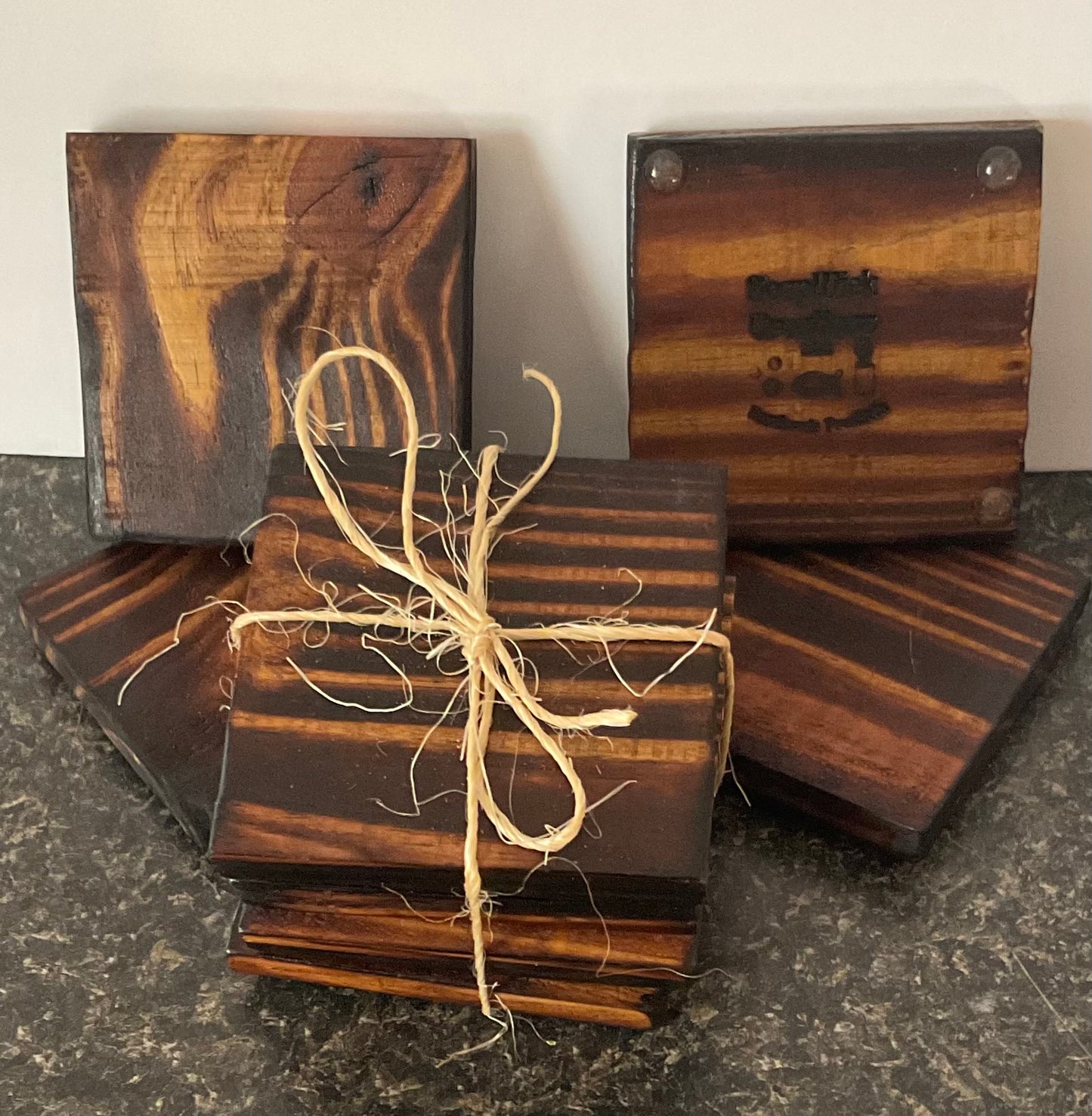 Picture of a Set of 4 wooden coasters with non-skid feet