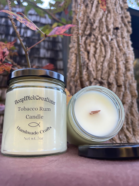 Photo of a white candles scented with tobacco and rum